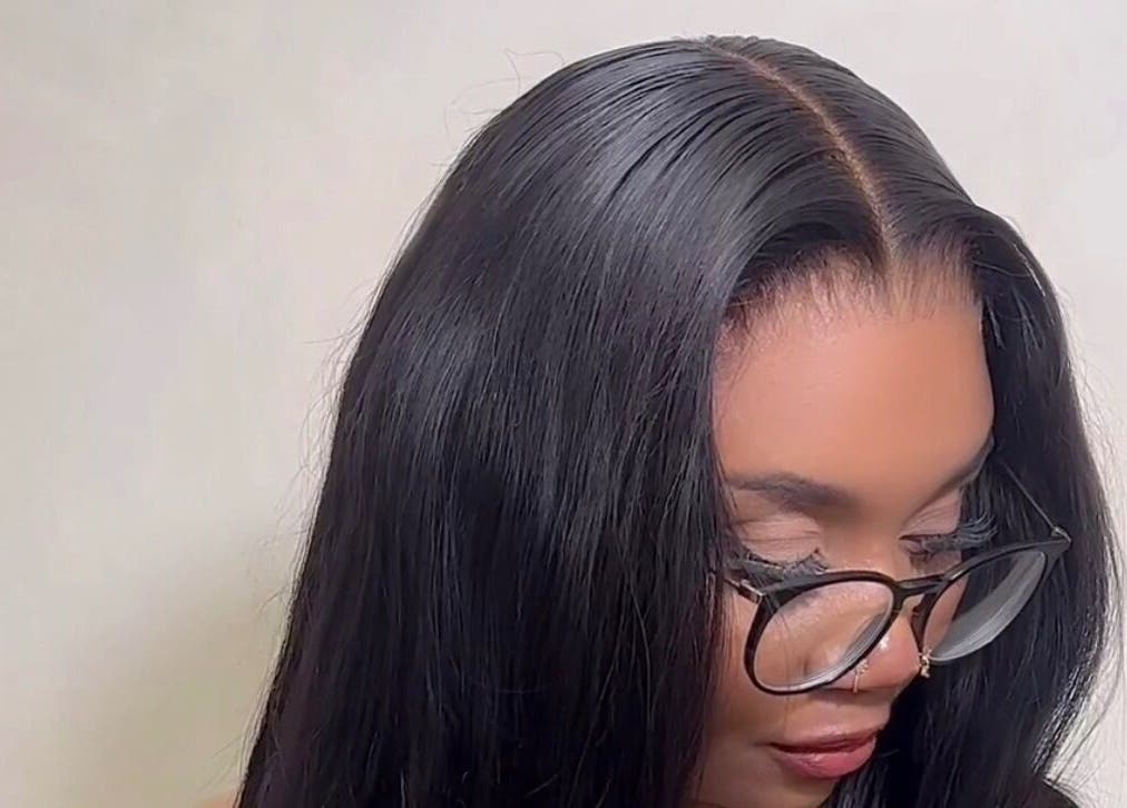 Woman with sleek black hair at M London Studios, Barking, England, GB, showcasing a chic hairstyle.