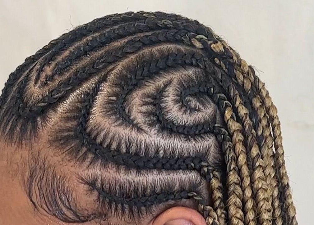 Intricate braided hairstyle at M London Studios, Barking, England, GB showcasing expert craftsmanship.