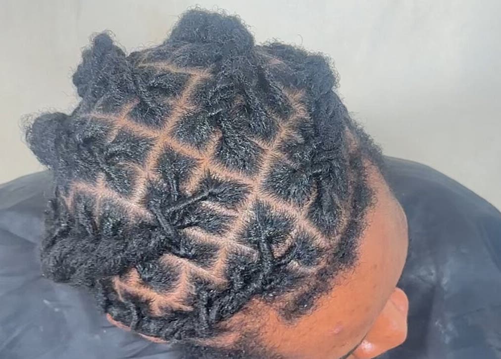 Detailed natural hair styling at M London Studios, located in Barking, England, GB, showcasing expert technique.