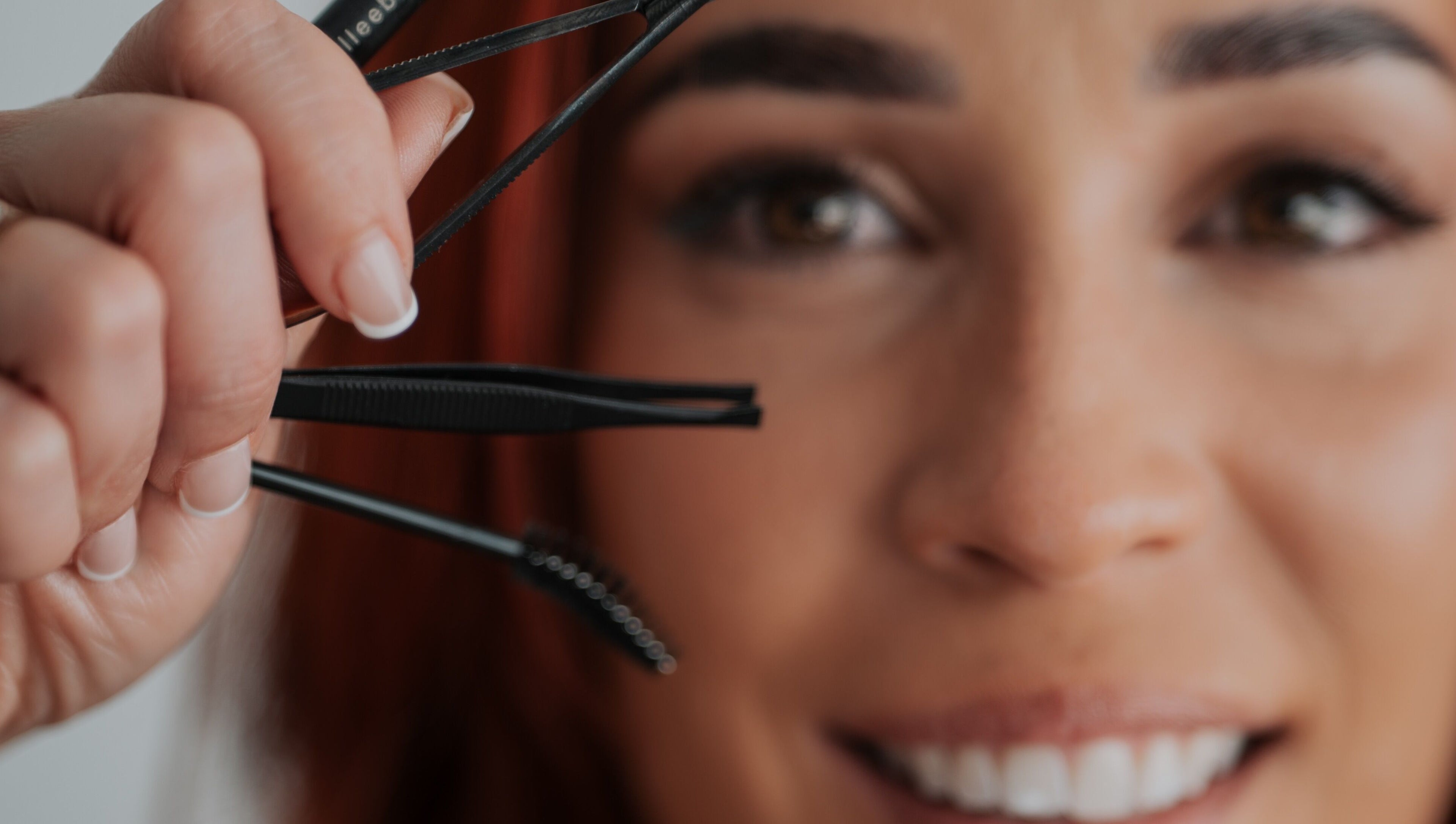 Close-up of a woman using tweezers at Gely Precious, Colorado Springs, Colorado, US.