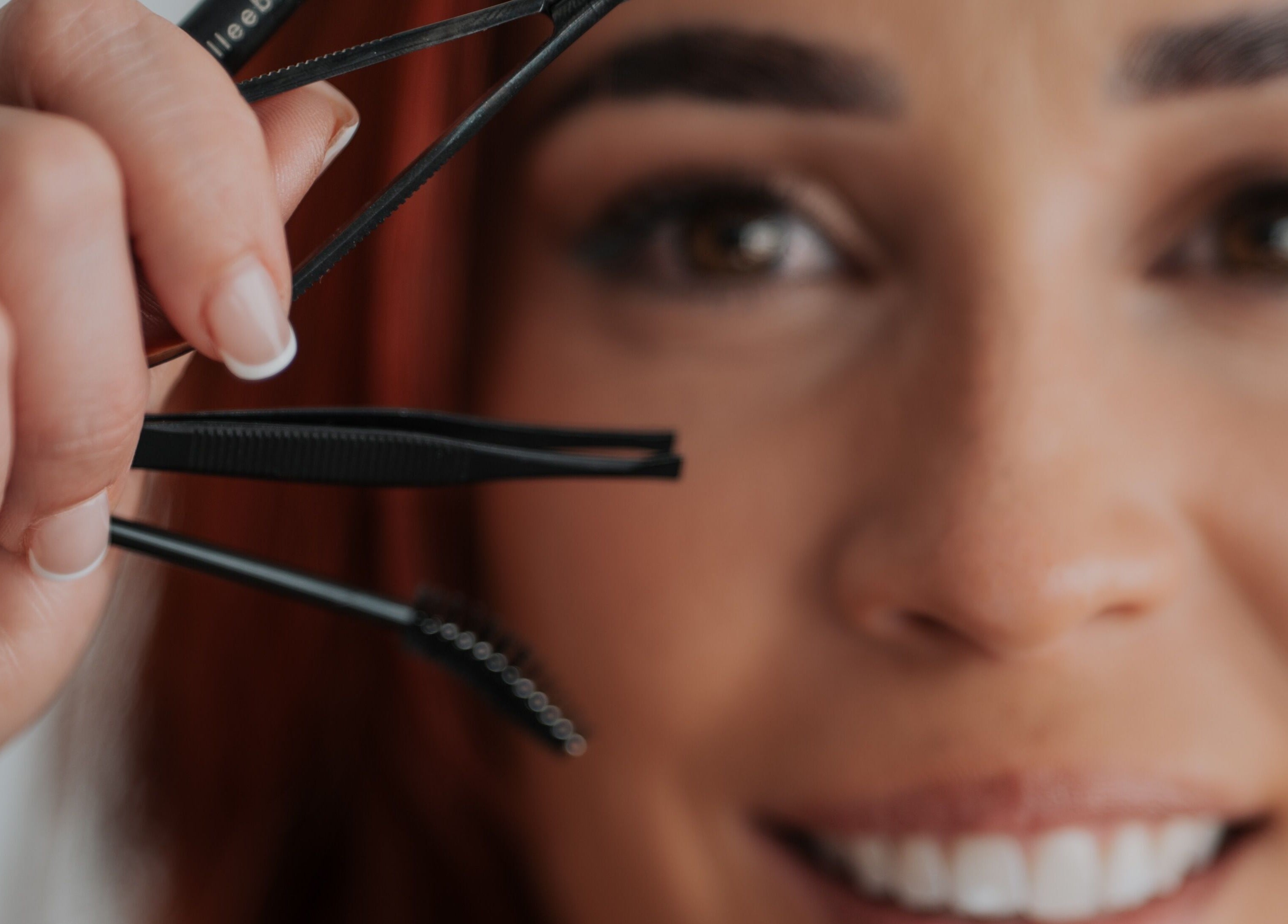 Close-up of a woman using tweezers at Gely Precious, Colorado Springs, Colorado, US.