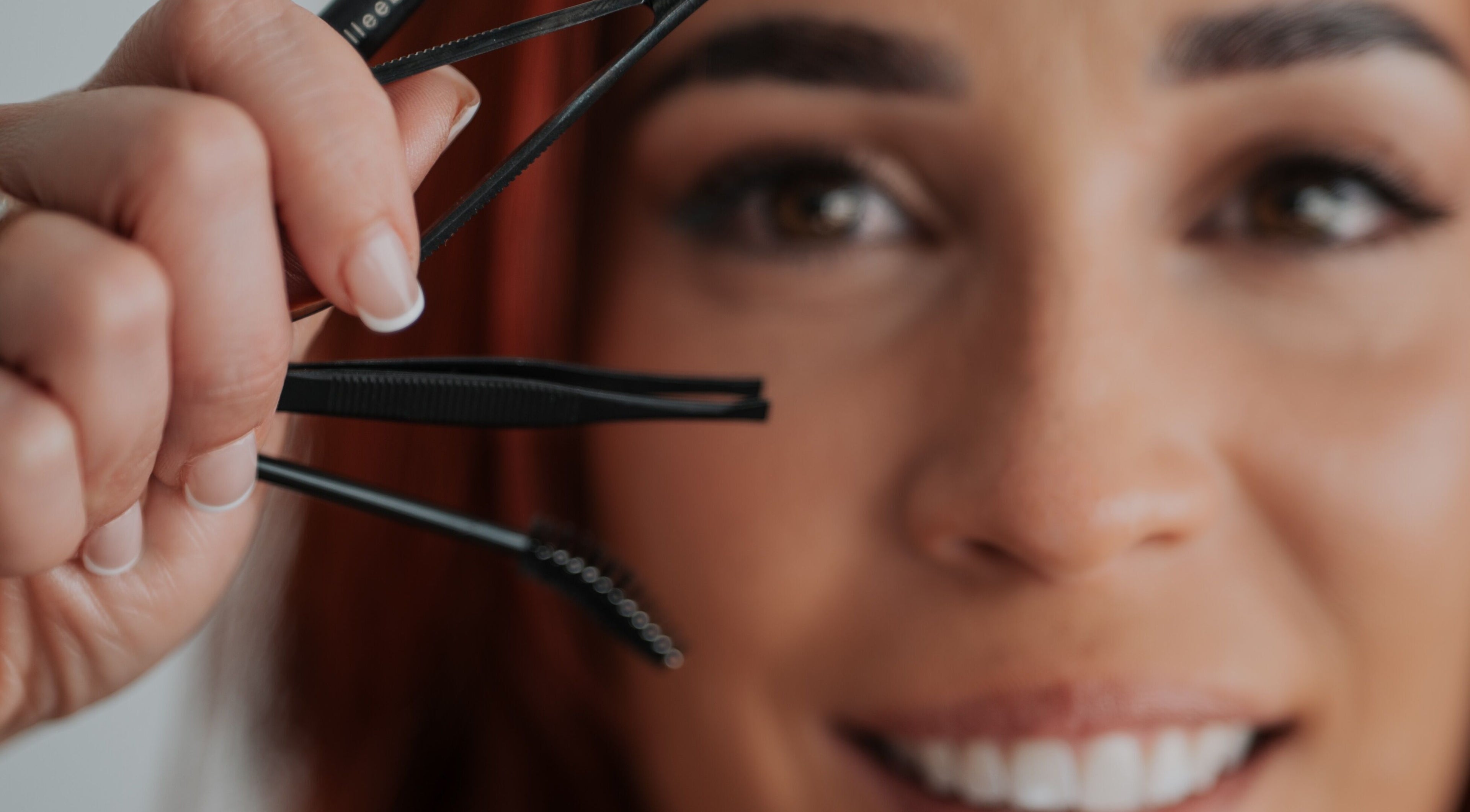Close-up of a woman using tweezers at Gely Precious, Colorado Springs, Colorado, US.