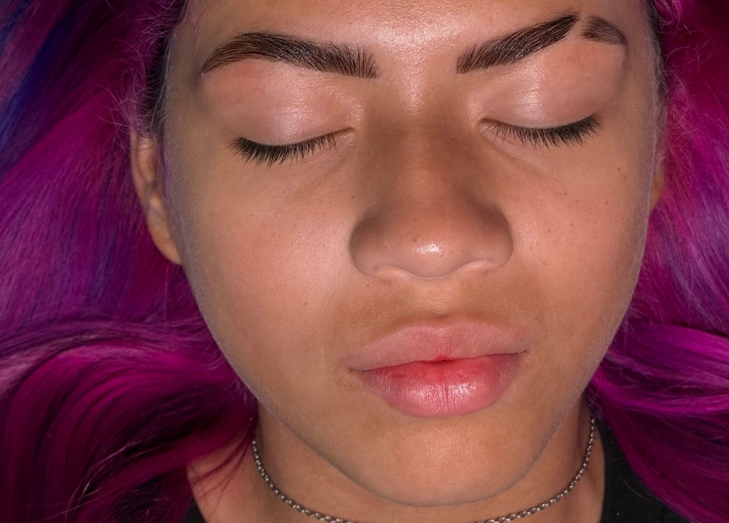 Relaxed face with vibrant pink hair at Gely Precious, Colorado Springs, Colorado, US.