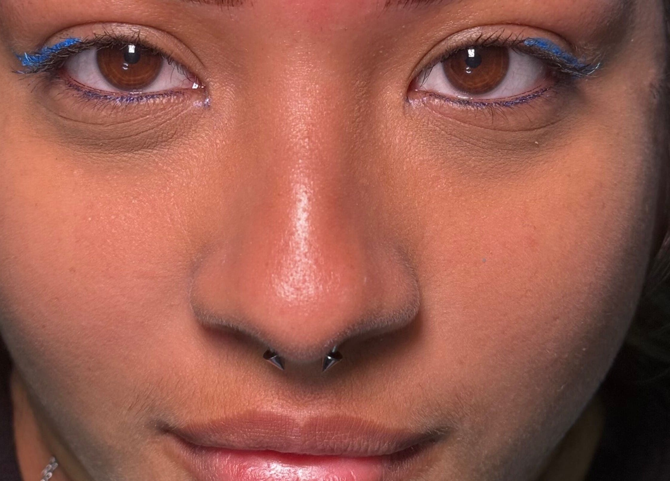 Close-up of a face with bold makeup at Gely Precious, Colorado Springs, Colorado, US.