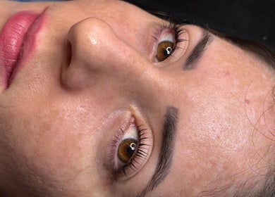 Close-up of a woman's radiant skin and eyebrows at Gely Precious in Colorado Springs, Colorado, US.