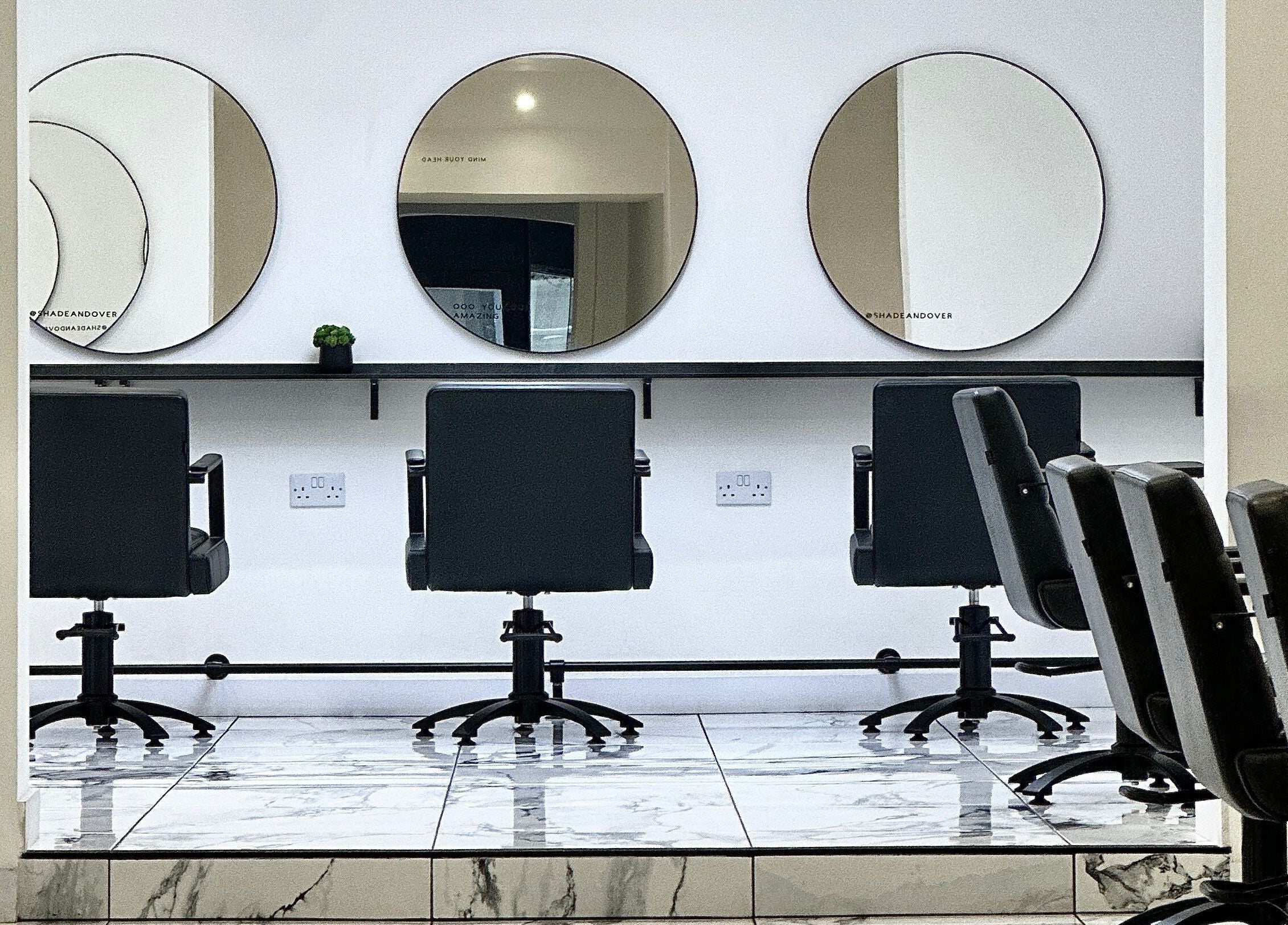 Elegant salon chairs and mirrors at SHADE ANDOVER, Andover, England, GB offer a modern beauty experience.