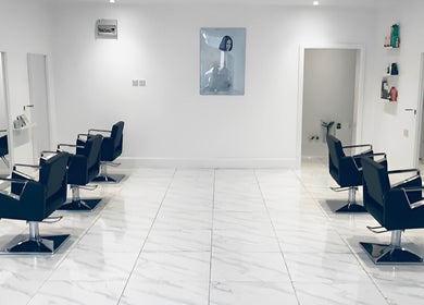 Modern salon interior with sleek styling chairs at SHADE ANDOVER, Andover, England, GB.