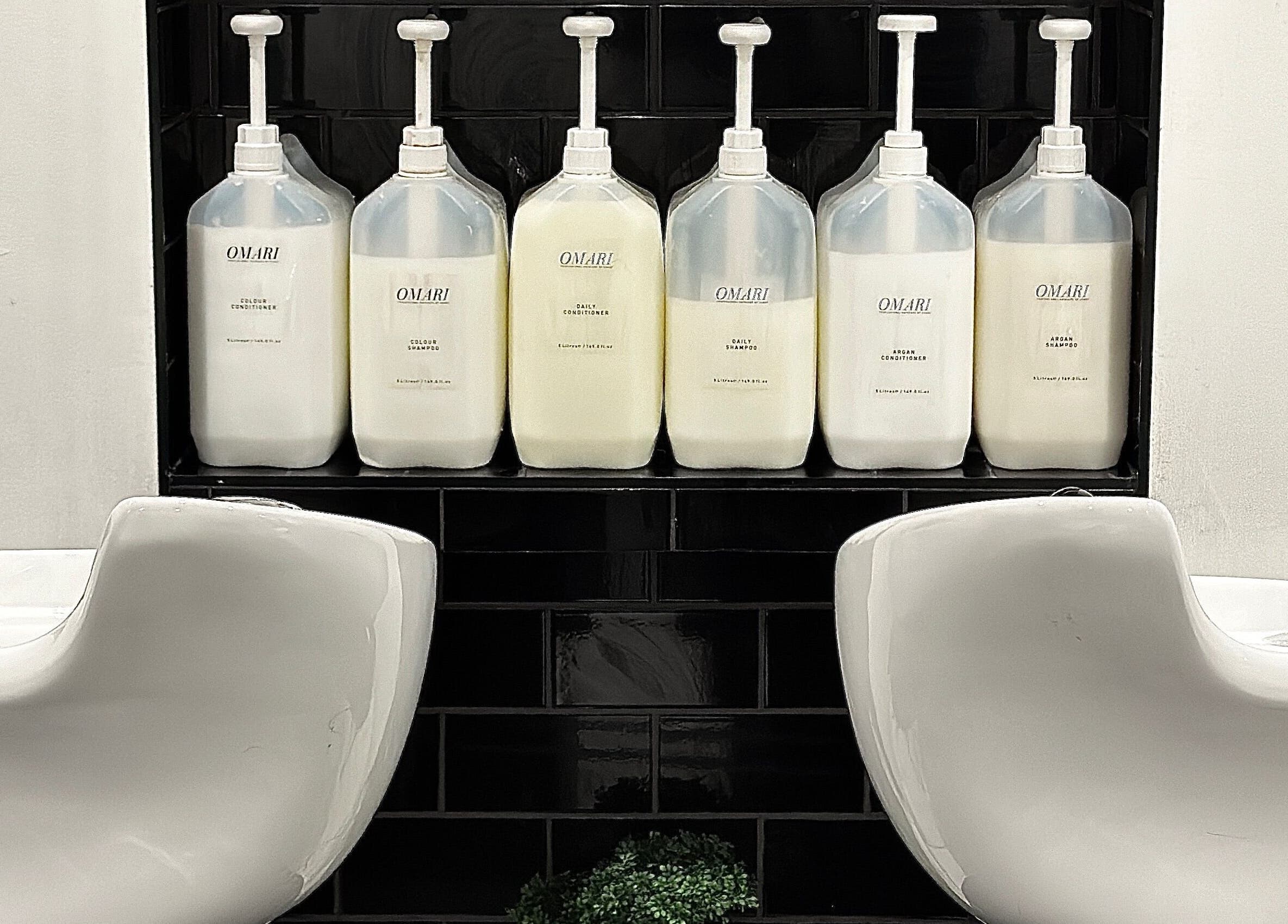 Elegant washbasins with Omari bottles at SHADE ANDOVER, Andover, England, GB.