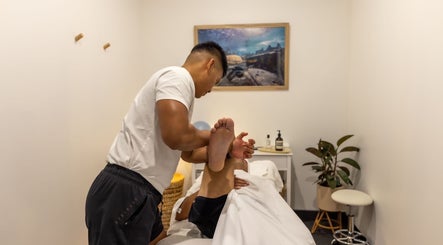 Massage therapist performing leg stretch at Kazspace in Sydney, Potts Point, New South Wales, AU.