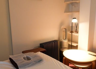 Cozy massage room at Kazspace in Sydney, Potts Point, New South Wales, AU with ambient lighting and massage bed.
