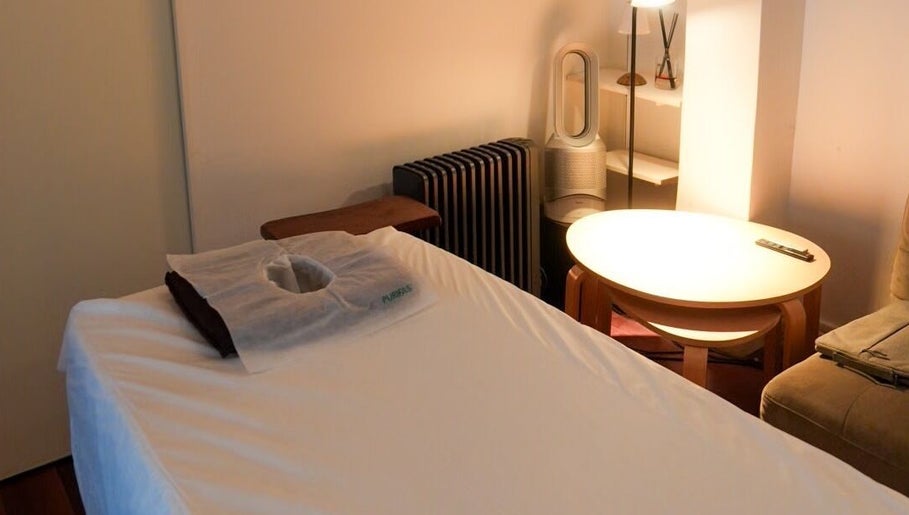 Serene treatment room at Kazspace in Sydney, Potts Point, New South Wales, AU with a massage table and ambient lighting.