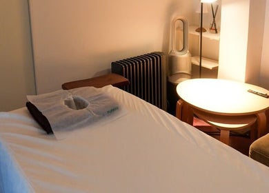 Serene treatment room at Kazspace in Sydney, Potts Point, New South Wales, AU with a massage table and ambient lighting.