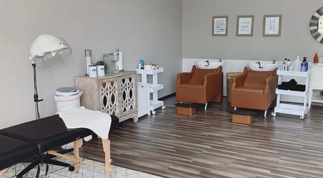 Sophisticated interior at Emily Tyler Hair, Rochester Hills, Michigan, US, with salon chairs and hair styling stations.