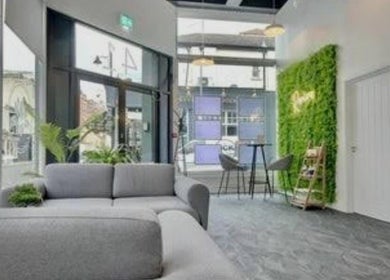 Bright seating area at Katie Betty Laser & Aesthetics, Portsmouth, England, GB featuring modern design and greenery.