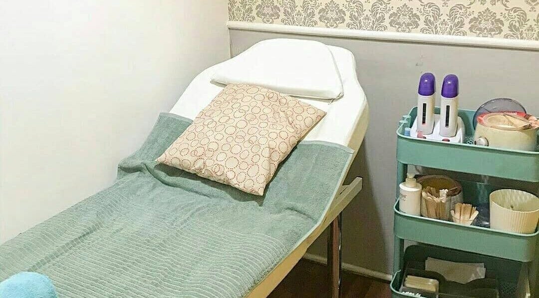 Relaxing waxing room at Justwax Serpong in Banten, Banten, ID, featuring a comfortable treatment bed.