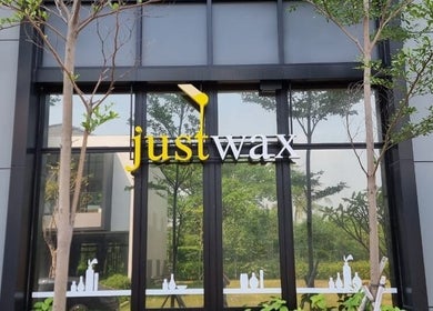 Justwax PIK exterior with clear signage, located in Daerah Khusus Ibukota Jakarta, ID.
