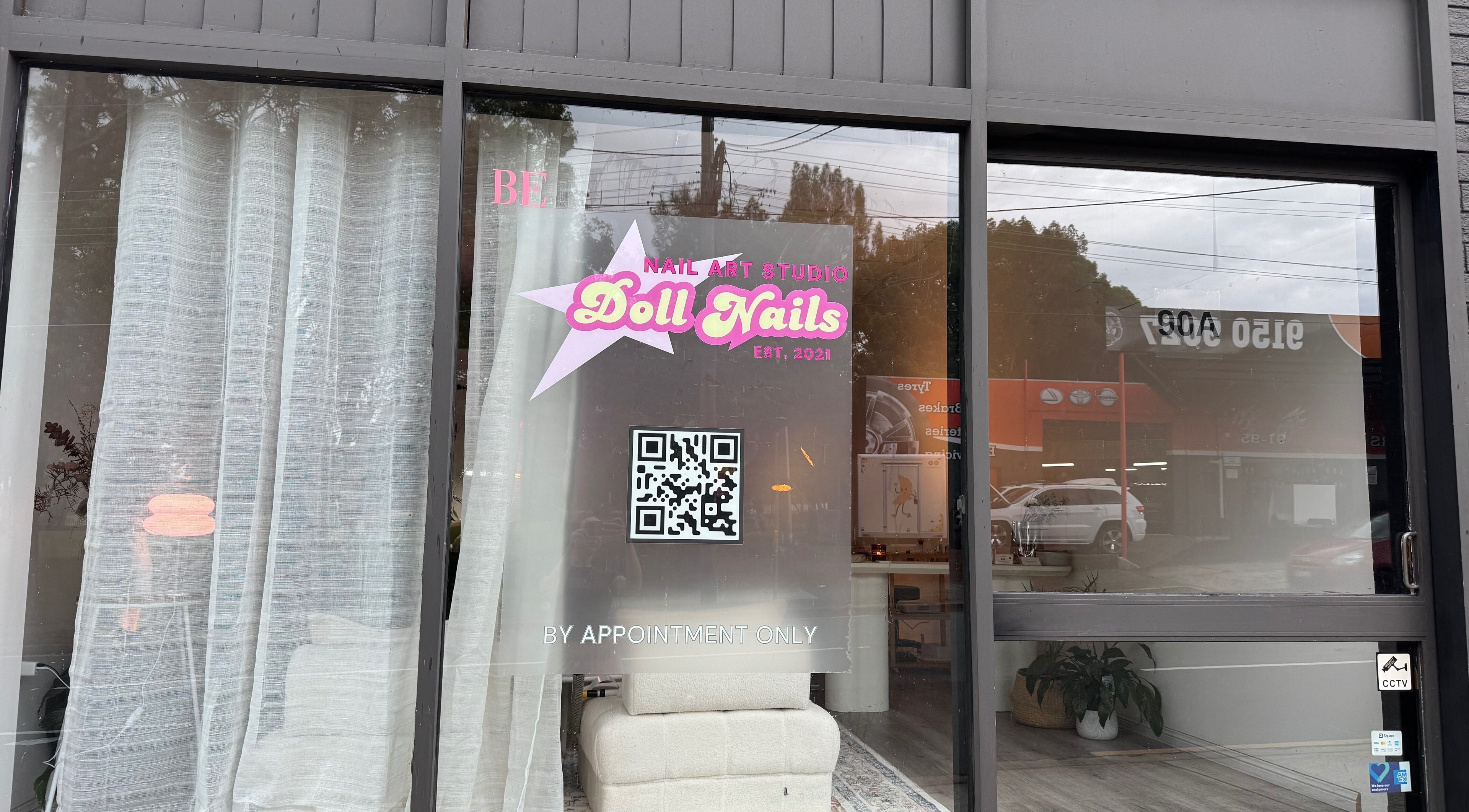 Front view of Doll Nails salon, Bexley, New South Wales, AU showcasing modern signage and decor.