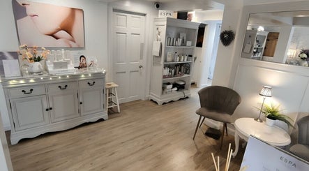 Modern, tranquil interior of Mirror Mirror Bingley in Bingley, England, GB featuring elegant decor and cozy seating.