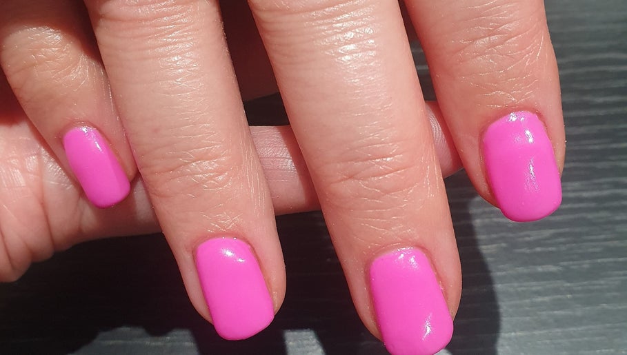 Bright pink manicure at Bare Faced Beauty by Charlie, Helsby, England, GB.