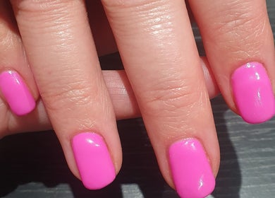 Bright pink manicure at Bare Faced Beauty by Charlie, Helsby, England, GB.