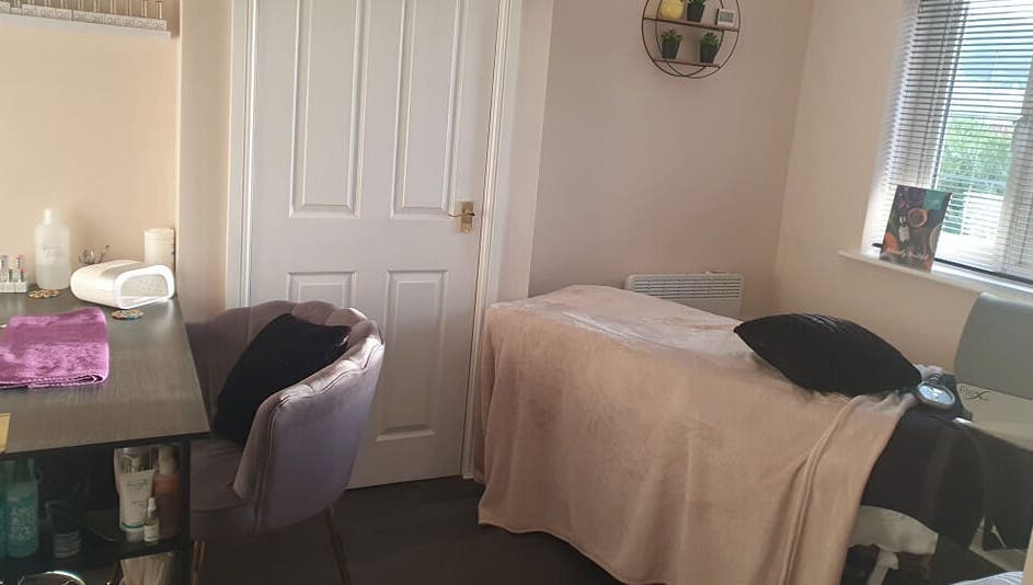 Cozy treatment room at BareFaced Beauty by Charlie in Helsby, England, GB offering a relaxing spa experience.