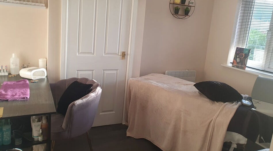 Cozy treatment room at BareFaced Beauty by Charlie in Helsby, England, GB offering a relaxing spa experience.