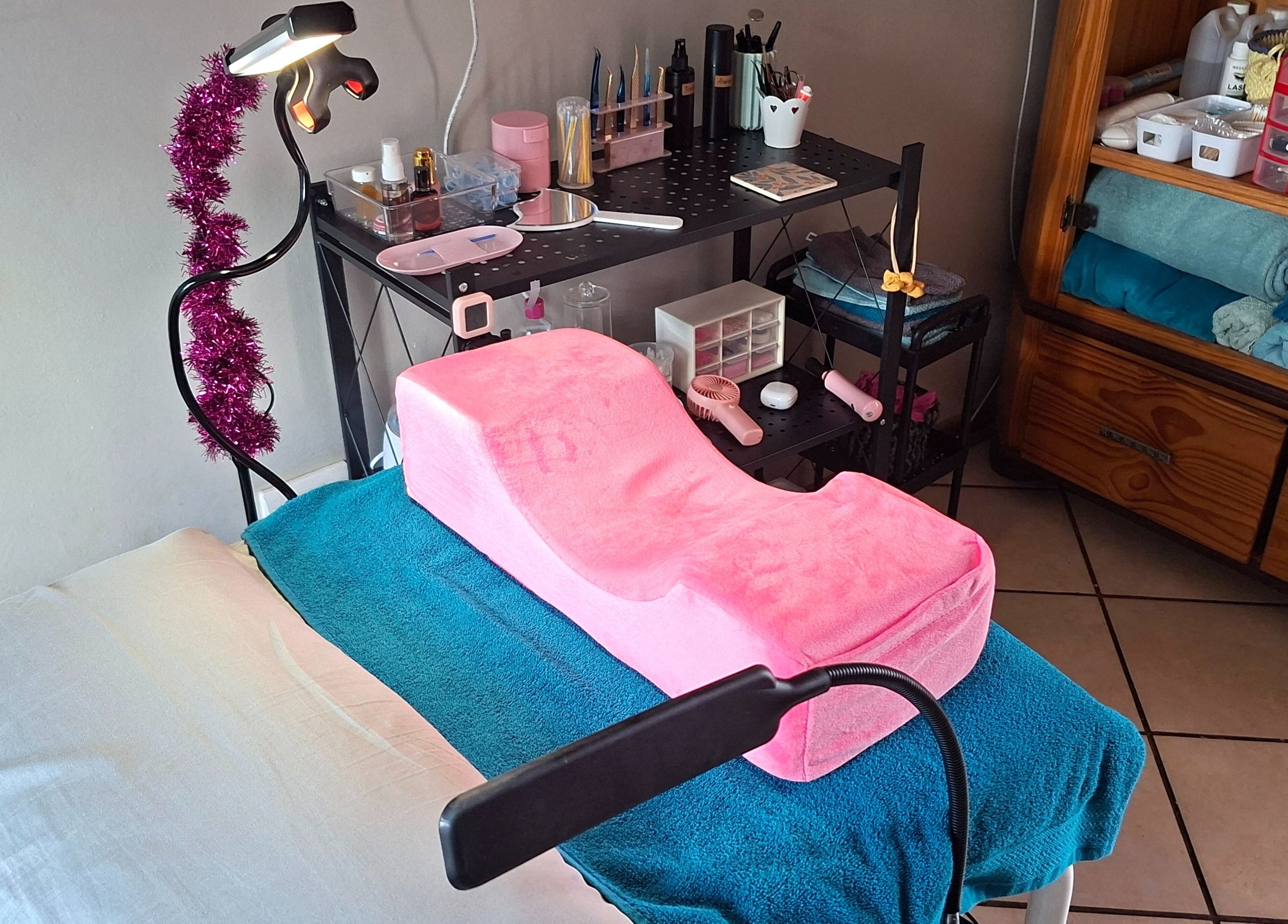 Beauty treatment setup at Glam Gaze, Meyerton, Gauteng, ZA, featuring pink cushion and organized beauty tools.