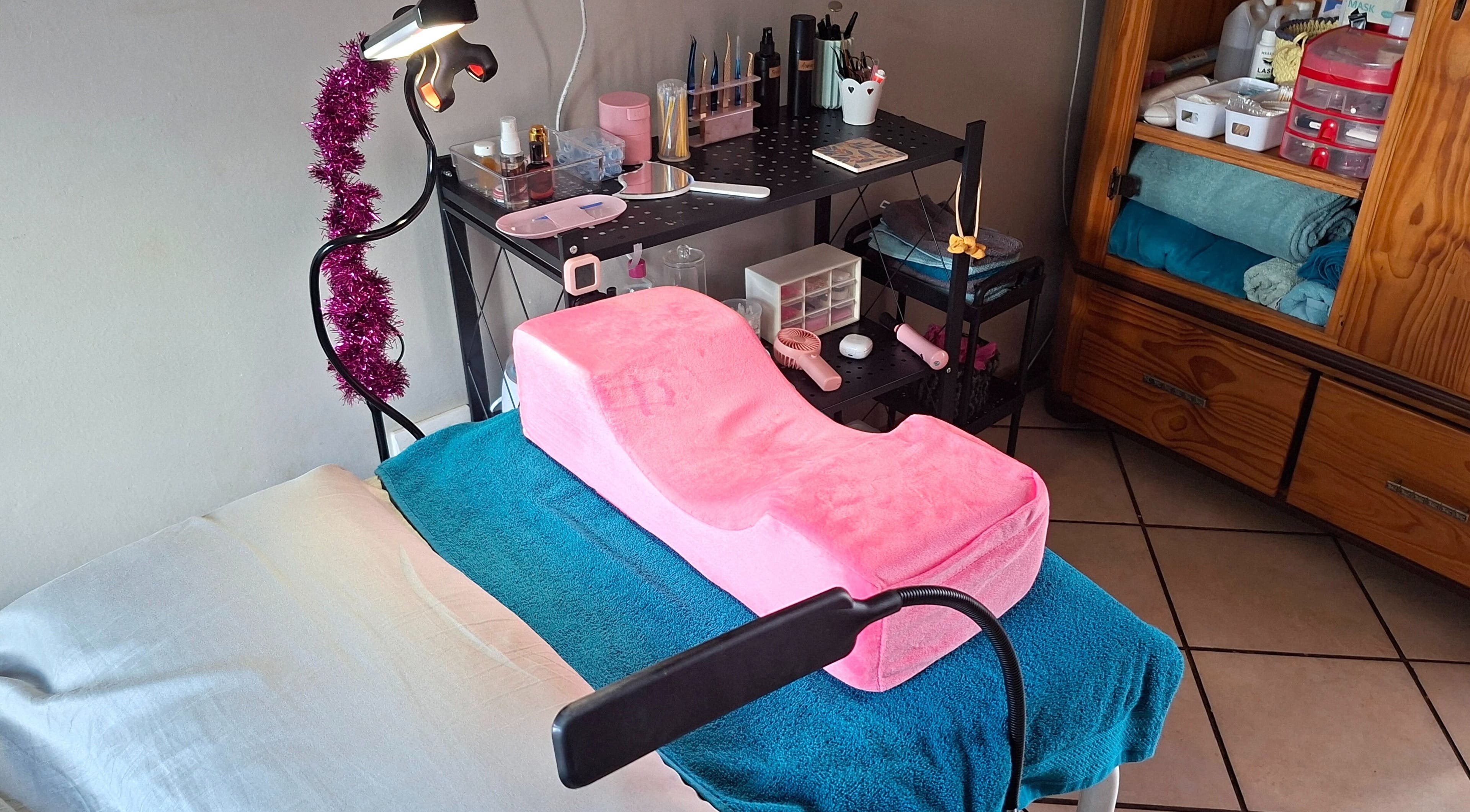 Beauty treatment setup at Glam Gaze, Meyerton, Gauteng, ZA, featuring pink cushion and organized beauty tools.