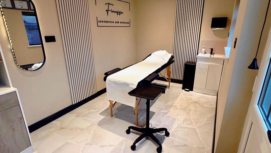 Relaxing treatment room at Finesse Aesthetics and Skincare, Burton-on-Trent, England, showcasing modern decor.