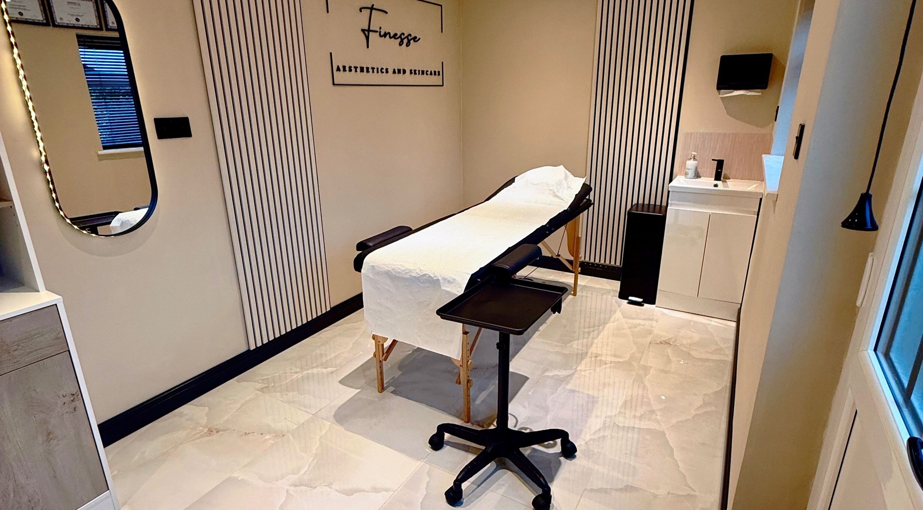 Relaxing treatment room at Finesse Aesthetics and Skincare, Burton-on-Trent, England, showcasing modern decor.