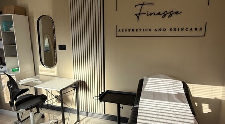 Treatment room at Finesse Aesthetics and Skincare, Burton-on-trent, England, GB with modern decor and a relaxing atmosphere.