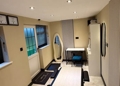 Cozy treatment room at Finesse Aesthetics and Skincare in Burton-on-trent, England, GB, featuring elegant decor.