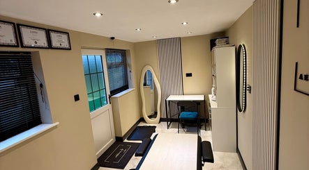 Cozy treatment room at Finesse Aesthetics and Skincare in Burton-on-trent, England, GB, featuring elegant decor.