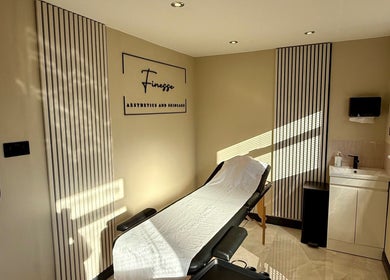 A serene treatment room at Finesse Aesthetics and Skincare in Burton-on-trent, England, GB, with a spa bed.