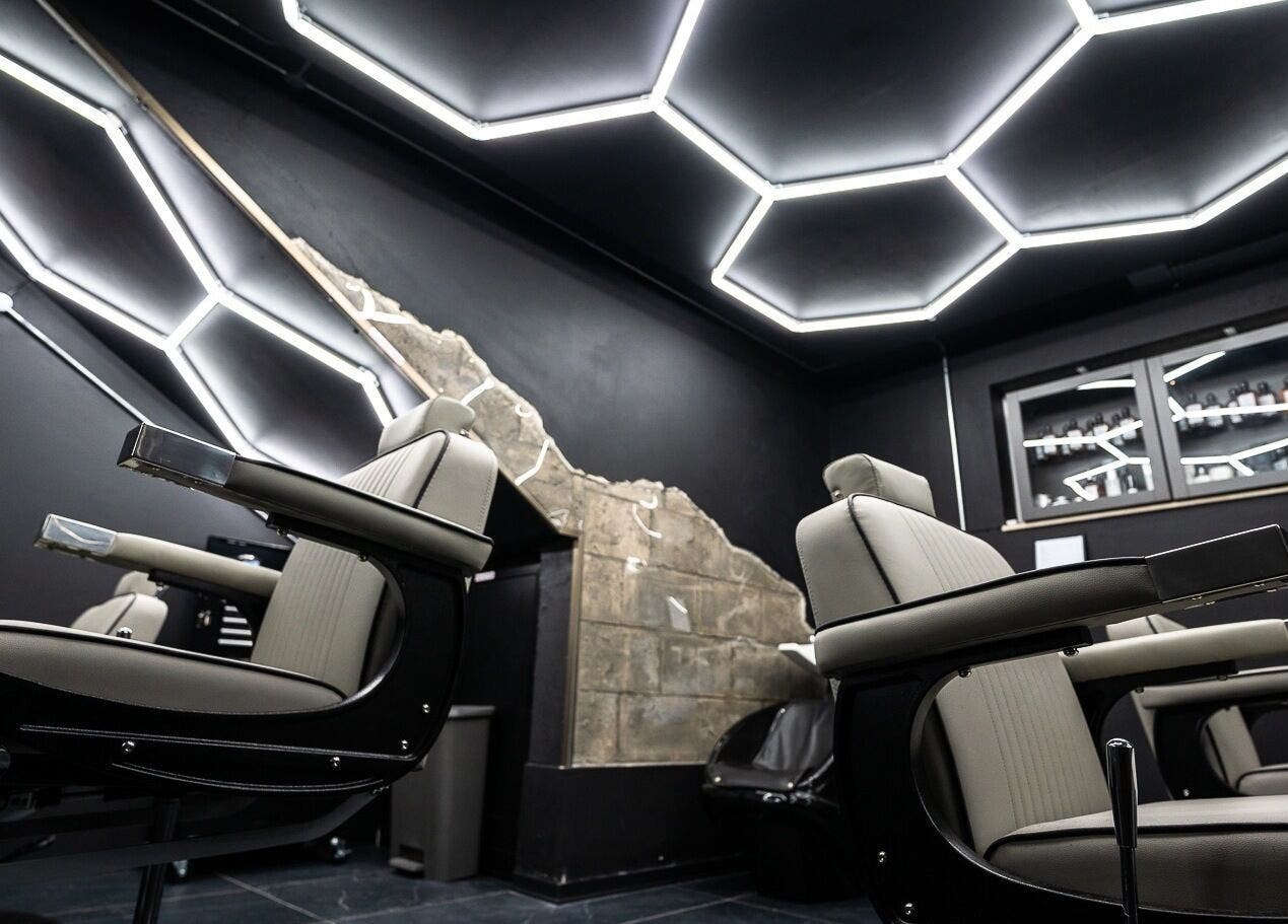 Modern barber chairs and sleek design at Mr. Dapper Barbers & Tattoo, L-imsida, MT enhancing the venue's vibe.