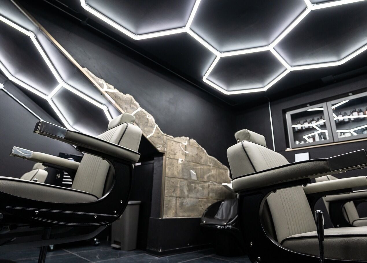 Modern barber chairs and sleek design at Mr. Dapper Barbers & Tattoo, L-imsida, MT enhancing the venue's vibe.