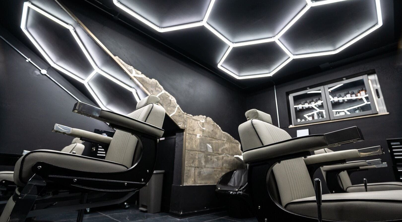 Modern barber chairs and sleek design at Mr. Dapper Barbers & Tattoo, L-imsida, MT enhancing the venue's vibe.