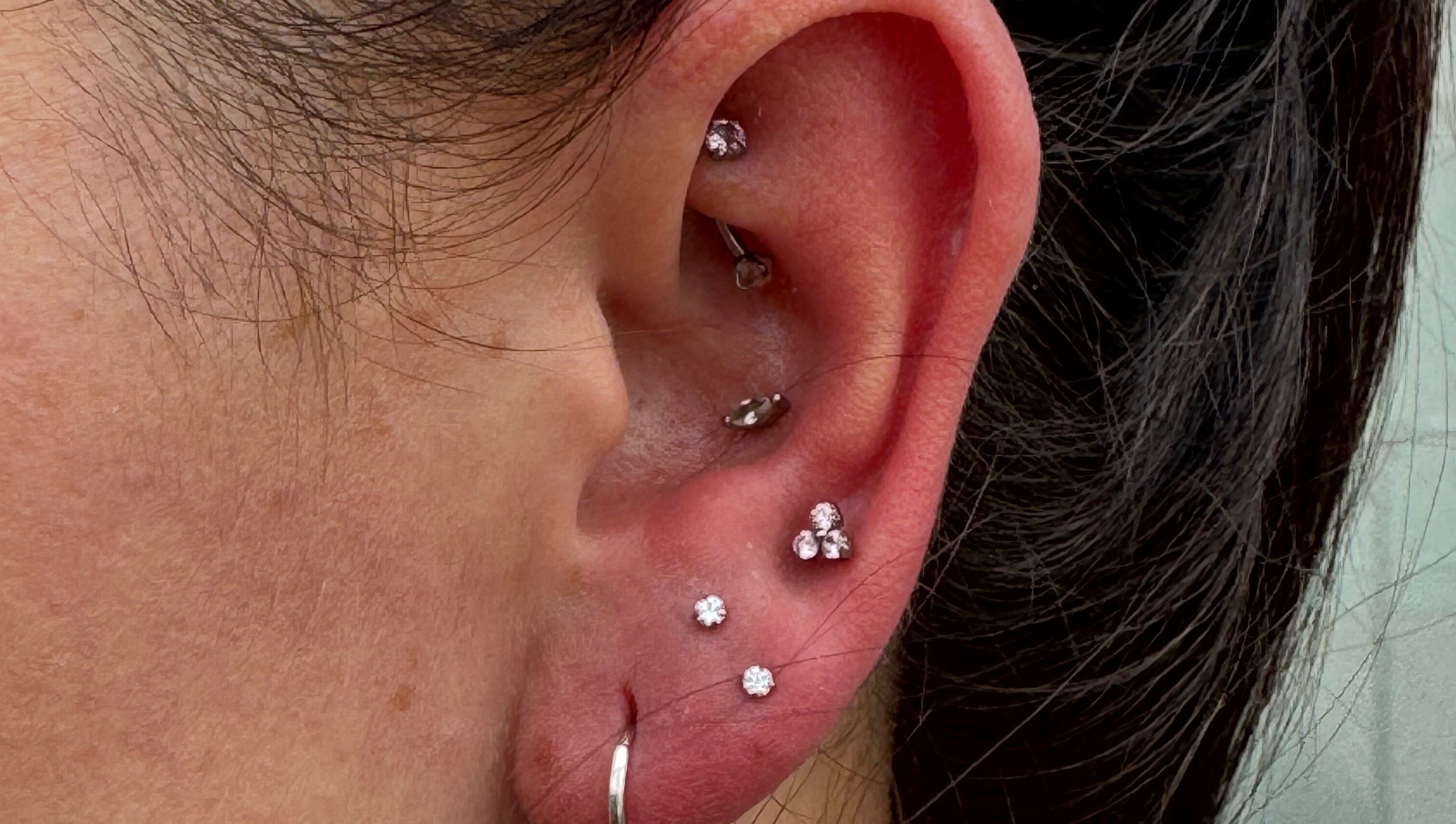 Intricate ear piercings with gemstones by Pretty Piercings by Sheree, Crosshill, Scotland, GB.