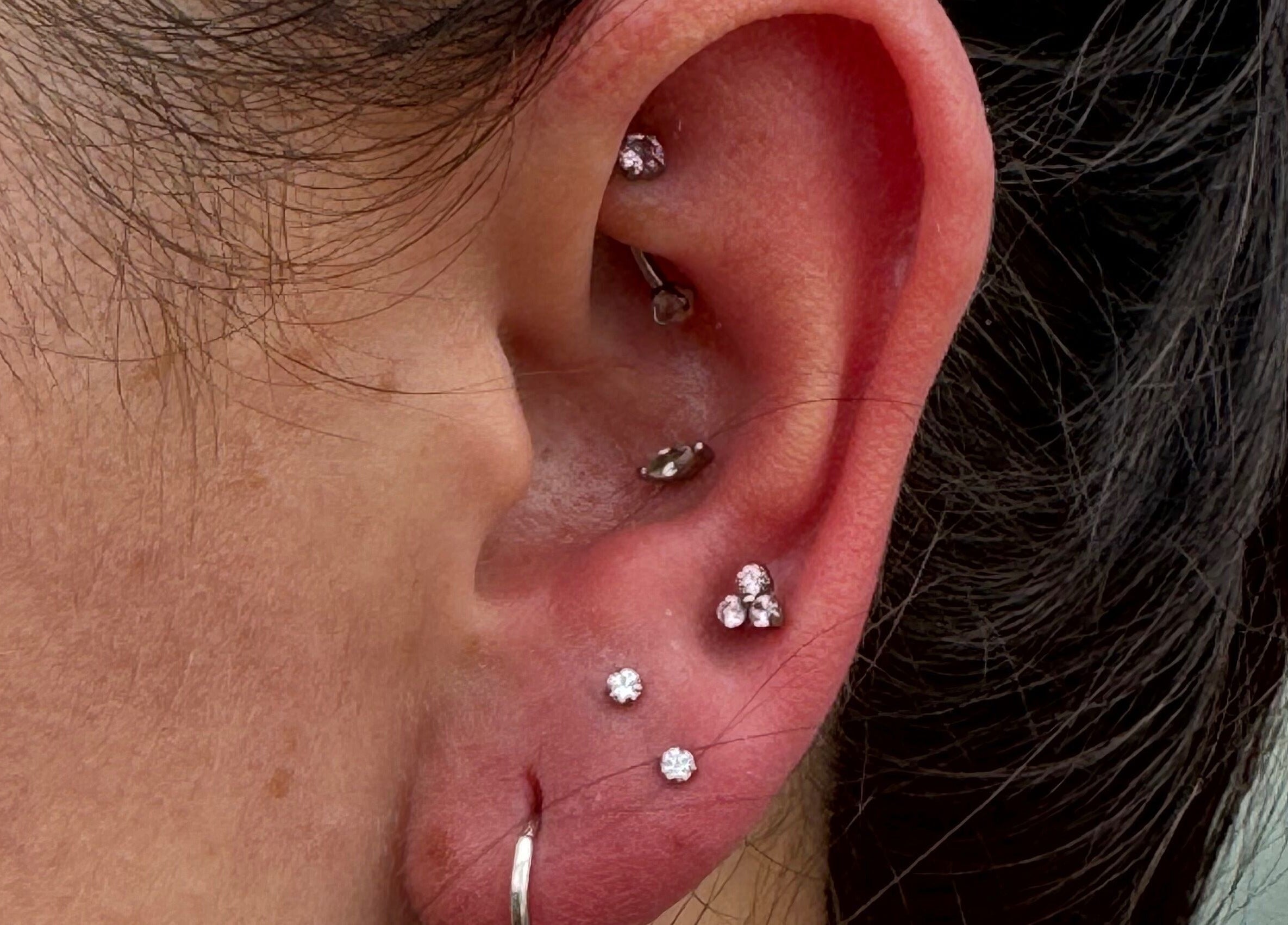 Intricate ear piercings with gemstones by Pretty Piercings by Sheree, Crosshill, Scotland, GB.