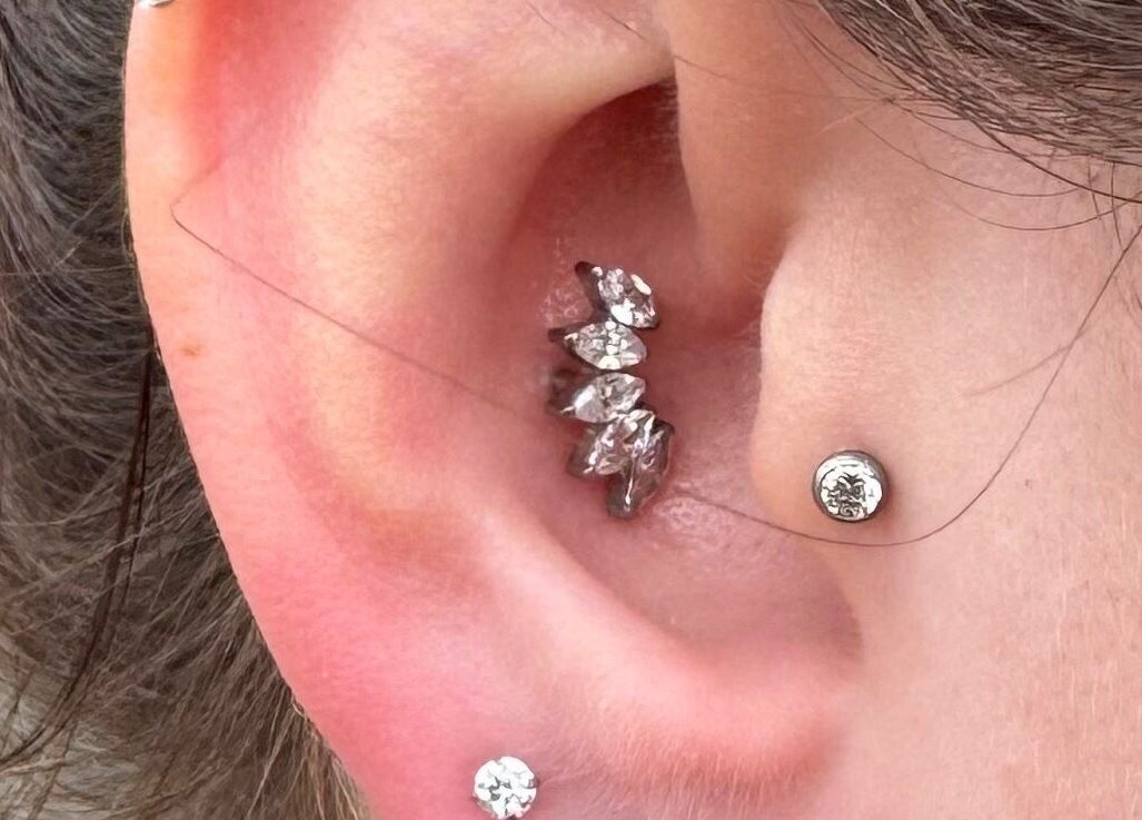 Chic ear piercings by Pretty piercings by Sheree in Crosshill, Scotland, GB showcasing elegant jewelry.