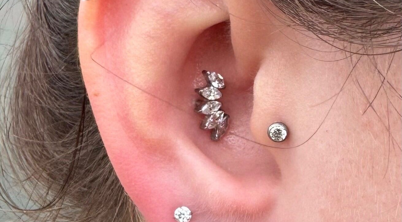 Chic ear piercings by Pretty piercings by Sheree in Crosshill, Scotland, GB showcasing elegant jewelry.