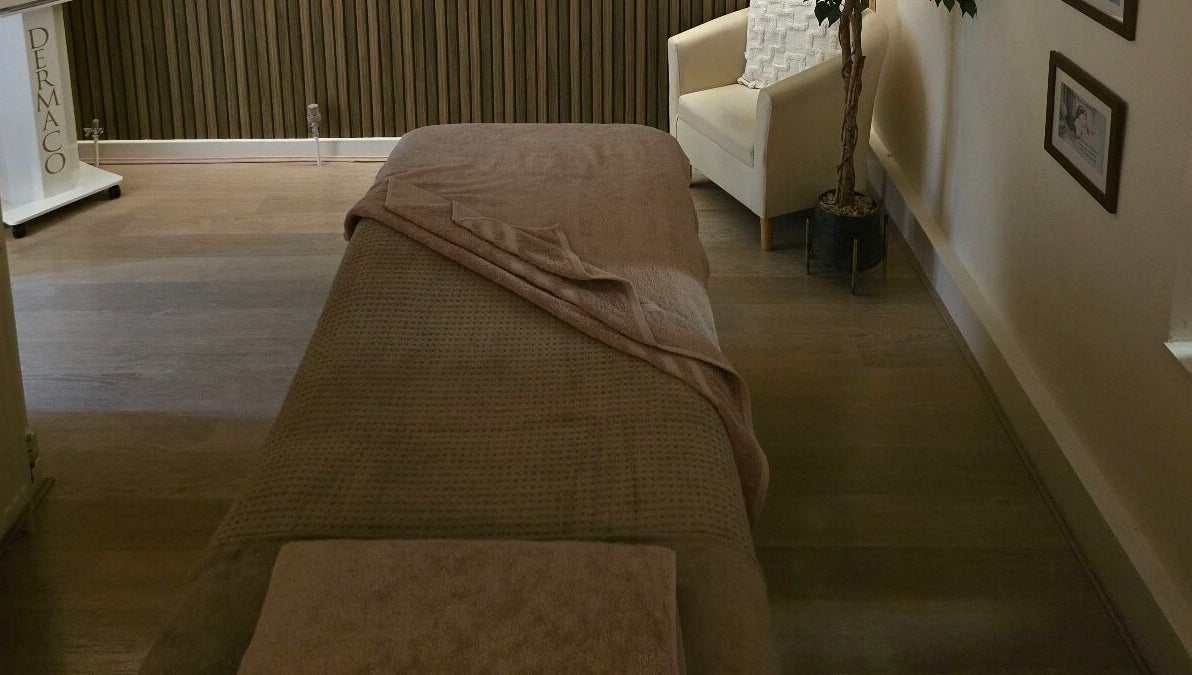 Tranquil massage room at AK Laser Beauty & Brows, Accrington, England, GB, featuring a cozy massage bed.