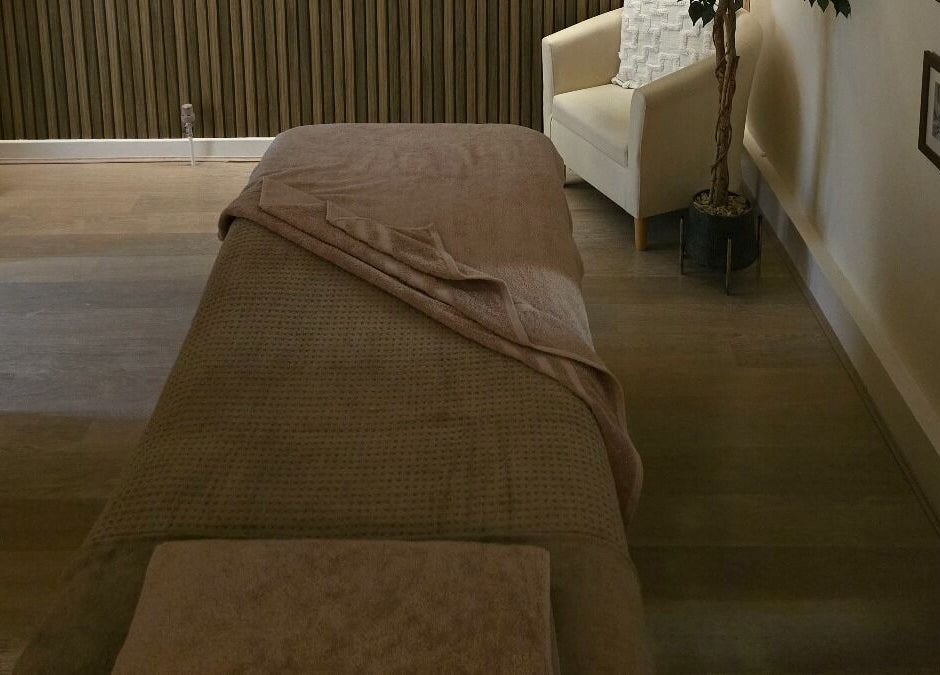 Tranquil massage room at AK Laser Beauty & Brows, Accrington, England, GB, featuring a cozy massage bed.