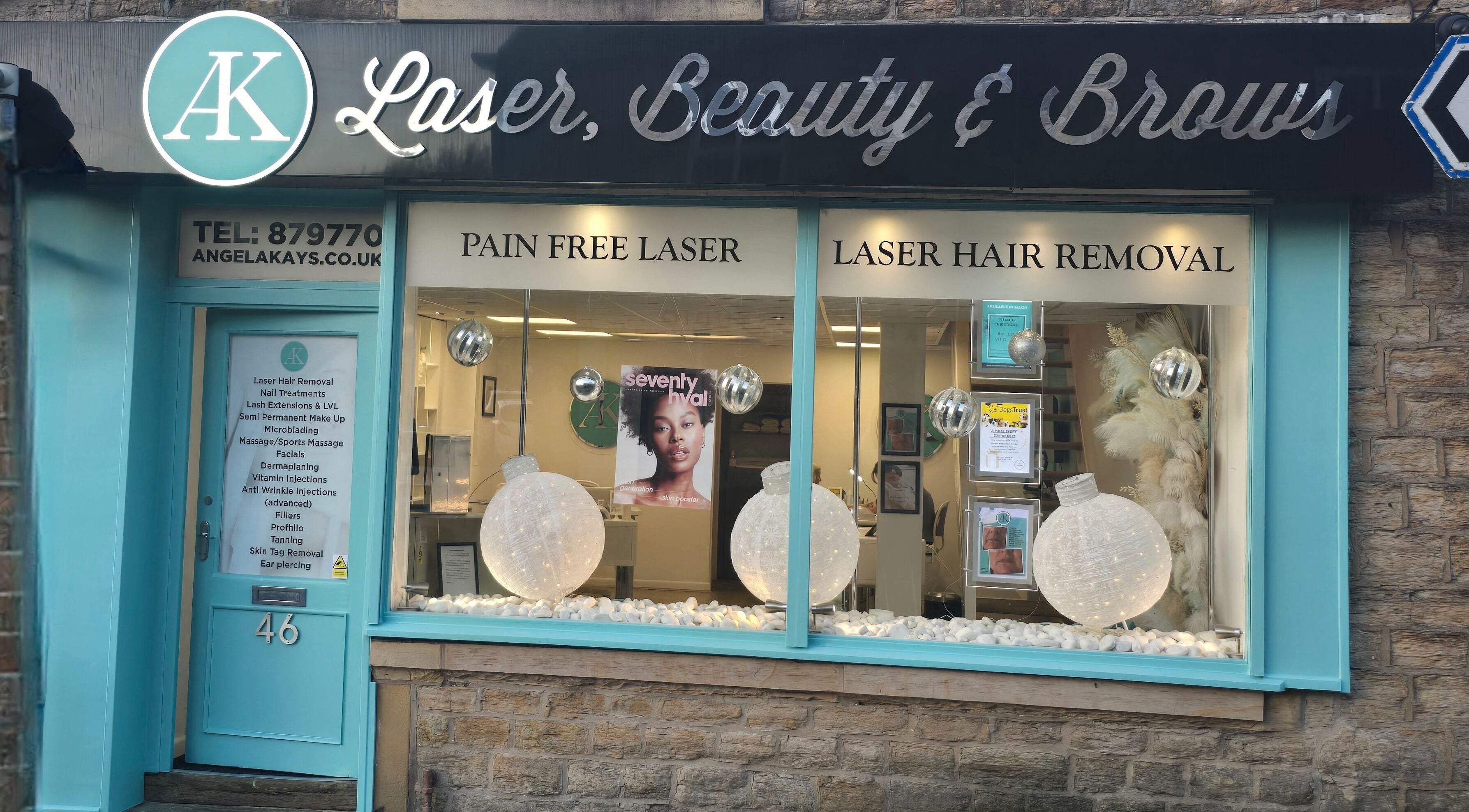 The storefront of AK Laser Beauty & Brows in Accrington, England, GB with elegant windows, signage, and decor.