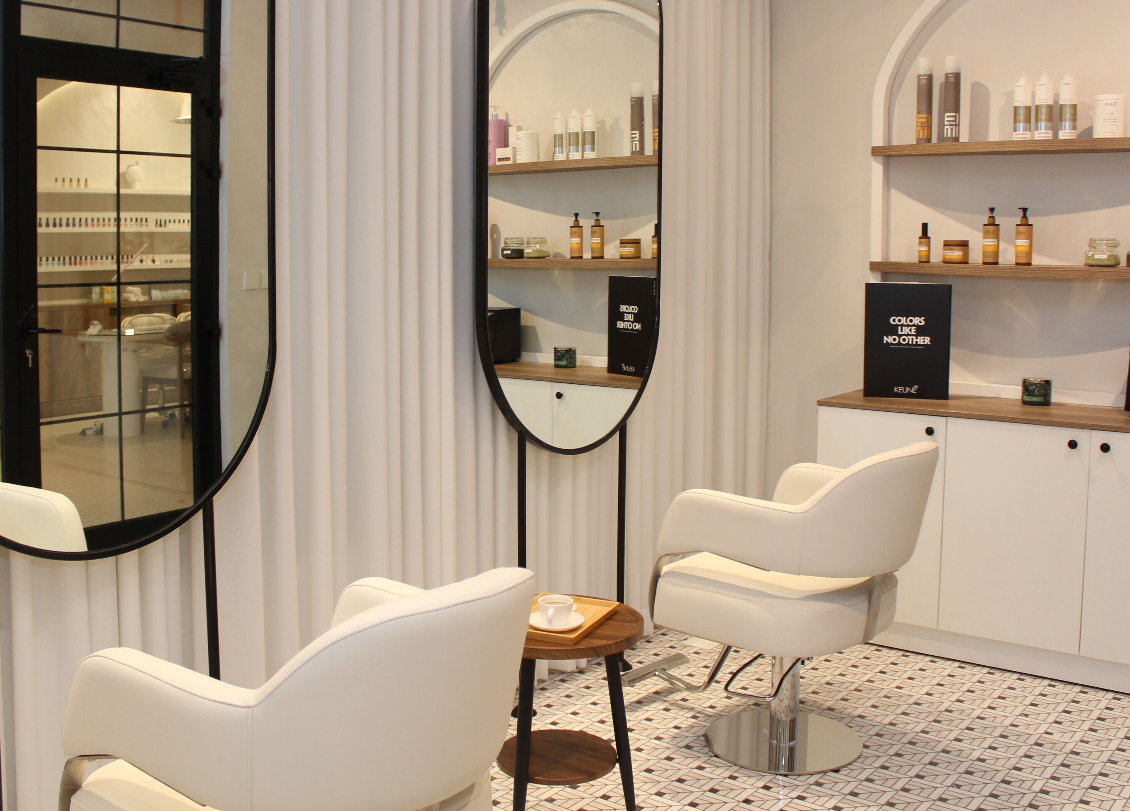 Elegant salon interior at Hayat and Spa, الخبر, المنطقة الشرقية, SA. Features stylish chairs and beauty products.