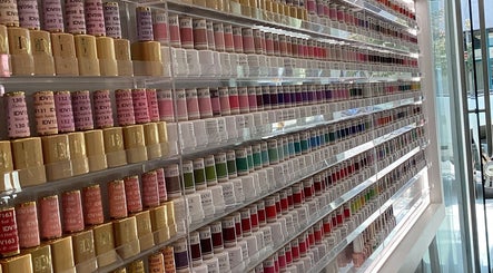 Vibrant nail polish collection at Champagne Nail Lounge on Drake, Vancouver, British Columbia, CA.