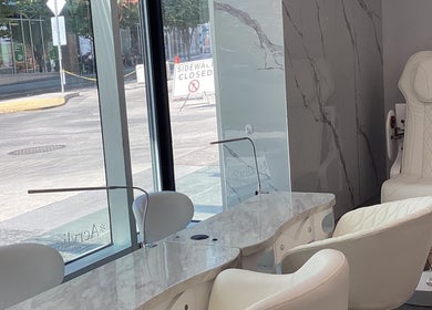 Modern interior of Champagne nail lounge on Drake in Vancouver, British Columbia, CA, featuring cozy seating.