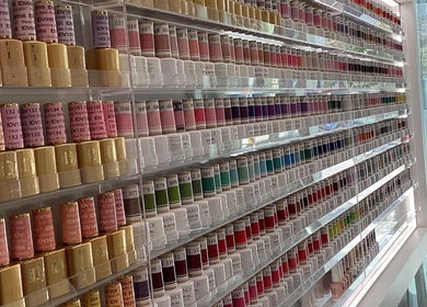 A vibrant nail polish display at Champagne Nail Lounge on Drake, Vancouver, British Columbia, CA.