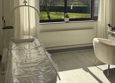 Bright treatment room at All Things Beauty in Flitwick, England, GB with modern equipment and outdoor views.