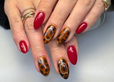 Stylish red and tortoiseshell nails at All Things Beauty, Flitwick, England, GB.